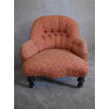 A Victorian mahogany framed button back nursing chair, upholstered in rouge fabric with gold leaf