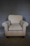 A Laura Ashley armchair upholstered in beige fabric. H. 86 x 90 x 86cm