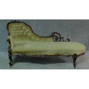 A Victorian carved mahogany framed chaise longue in sage buttoned upholstery on cabriole supports