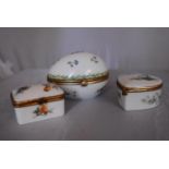 Three French Dubarry Limoges porcelain trinket boxes with floral design and gilded rope effect brass