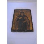 An antique painted icon on panel with Greek script. H.18 x 14cm