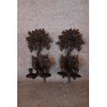 A pair of metal twin branch wall sconces with floral decoration to back plate. H.38cm