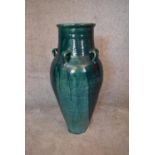 A large green drip glazed sharab wine vessel with six handles. H.93 x 30cm