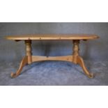 A large pine oval topped kitchen table. H.72 x 180 x 96cm