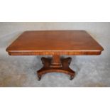 A Victorian mahogany tilt top dining table on quadruped platform base. H.76 x 136 x 72cm