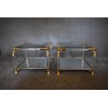 A pair of Empire style bedside tables with gilt metal rope motif, mirrored base and glass tops. H.60