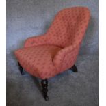A Victorian mahogany framed button backed nursing chair upholstered in rouge fabric. H.69 x 55cm