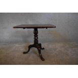 A 19th century mahogany tea table on tripod base with cabriole supports. H.52 x 59cm