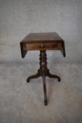 A small Regency mahogany drop flap table fitted frieze drawer opposing dummy drawer on tripod