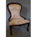 A mahogany framed spoon back nursing chair upholstered in multicolour fabric. H.88 x 55cm