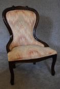 A mahogany framed spoon back nursing chair upholstered in multicolour fabric. H.88 x 55cm
