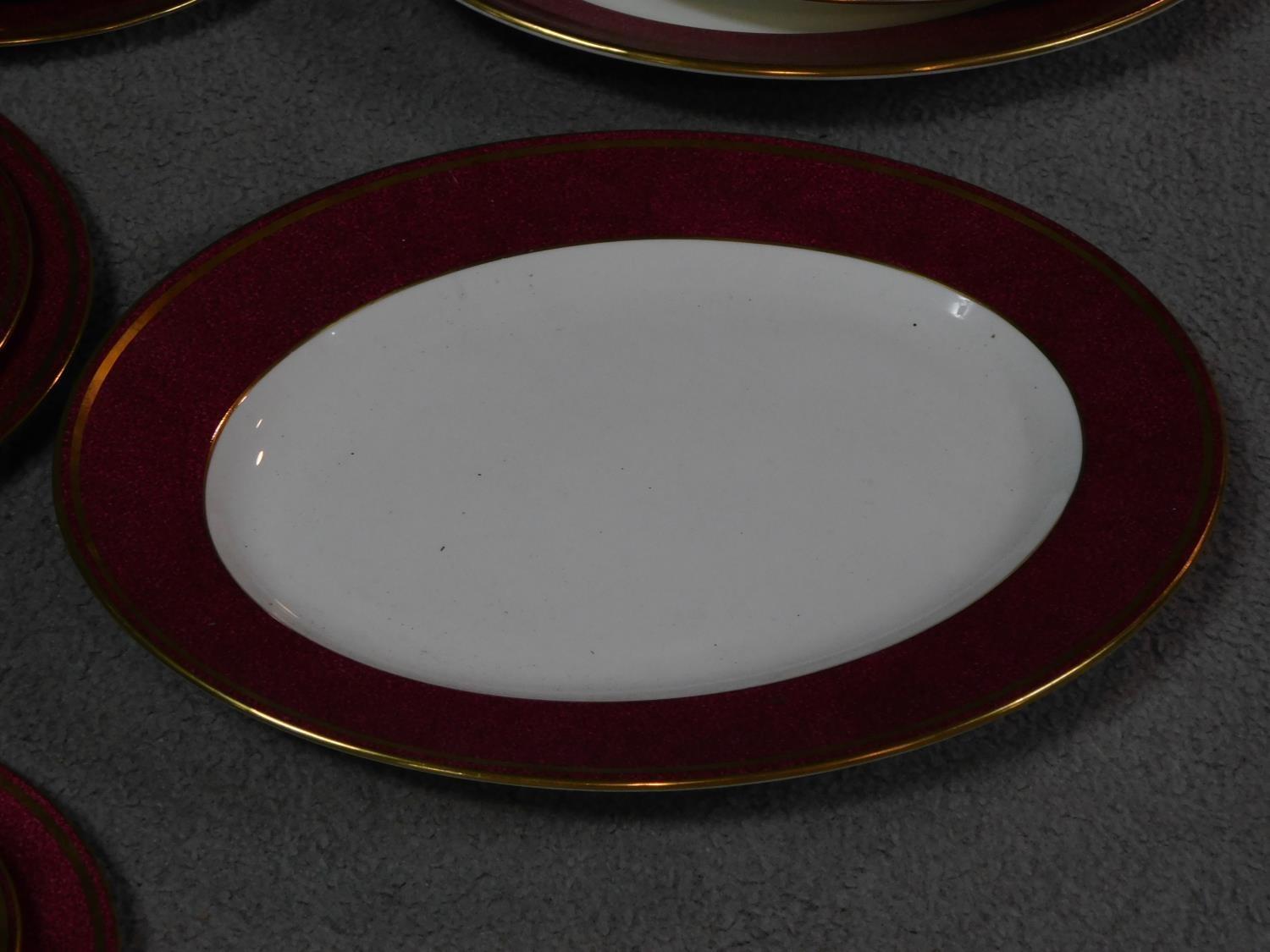 A complete Wedgwood Ulander powder ruby gilded dinner service. - Image 6 of 11