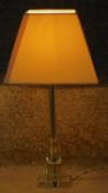 A vintage clear lead crystal faceted stemmed lamp on a square base. H.57cm