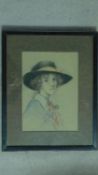 A framed and glazed pastel of a lady with a hat, unsigned. 51x41cm