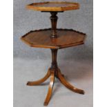 A Victorian mahogany two tier dumb waiter on swept tripod supports. H.67 W.46 D.46cm