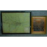 A framed and glazed vintage tube and train map of London and a framed copper plate engraving after