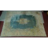 A Tabriz style rug, central floral medallion on a teal ground within stylised floral borders and