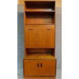 A mid 20th century two section teak bureau bookcase with mirrored and lit interior, by G-plan. H.198