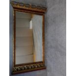A Victorian style giltwood floral carved mirror. 140x78cm