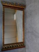 A Victorian style giltwood floral carved mirror. 140x78cm