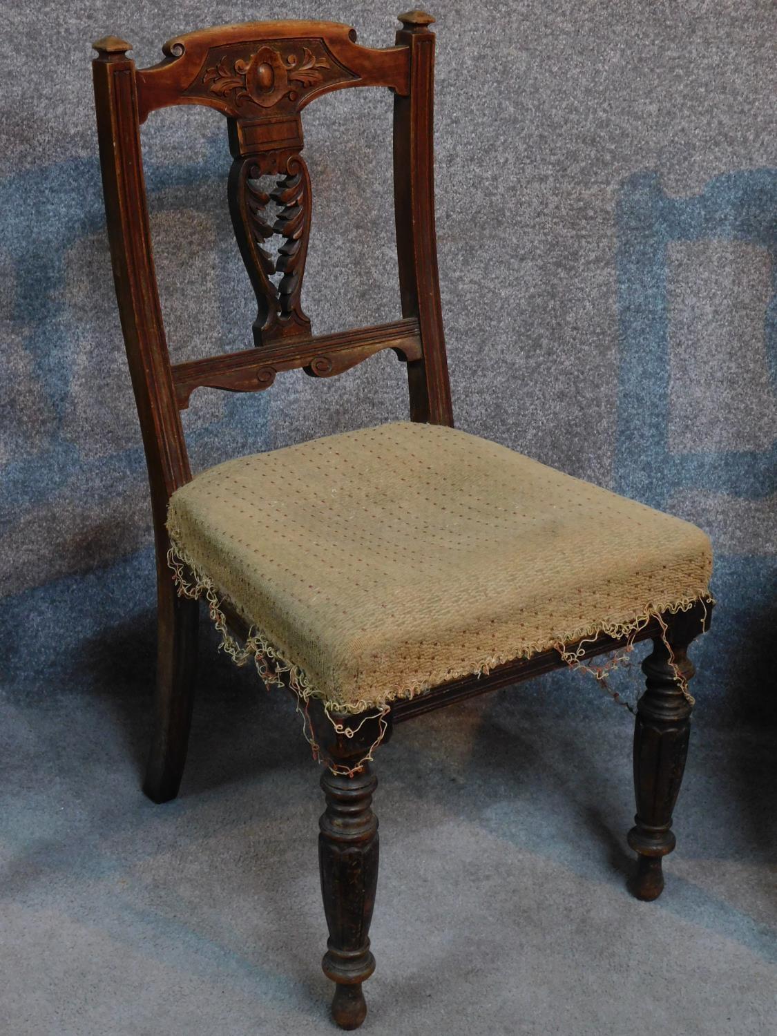 A set of six late Victorian carved walnut dining chairs raised on turned tapering supports. H.91cm - Image 2 of 6