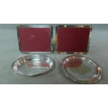 A pair of circular EPNS trays and a pair of silver plated rectangular Richard Carr photo frames.
