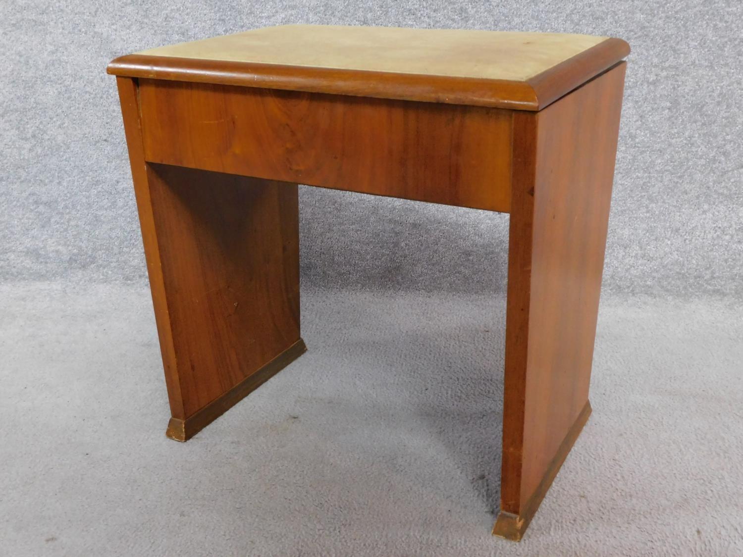 An Art Deco figured walnut piano stool with hinged lift up top enclosing sheet music compartment. - Image 2 of 5