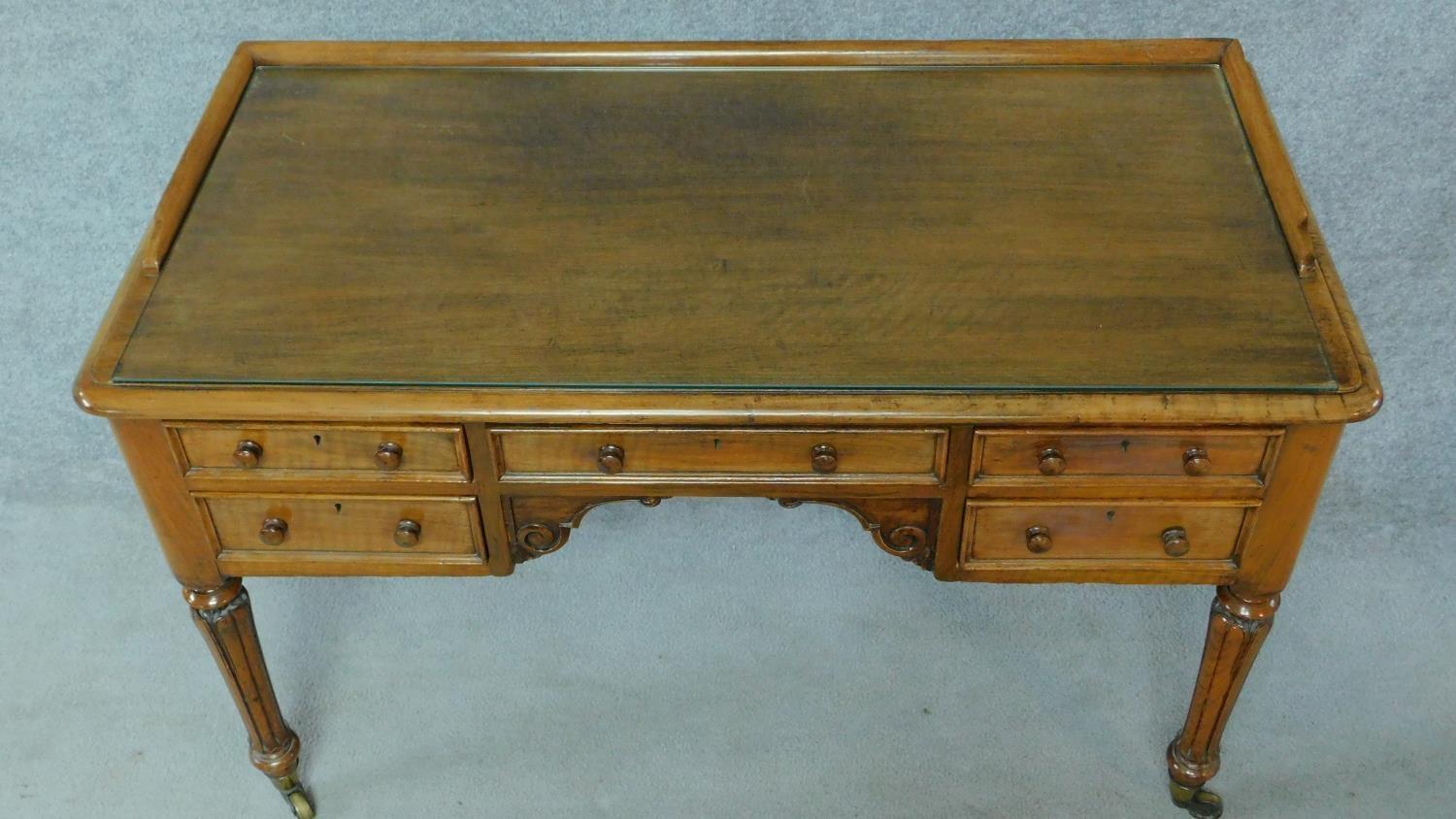 A William IV mahogany writing table with glass inset top and five frieze drawers, raised on tapering - Image 5 of 7