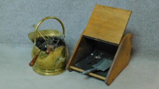 A brass coal bucket together with an oak coal scuttle and tools. H.30 W.33 D.44