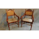A pair of Italian fruitwood carved armchairs in floral upholstery raised on turned stretchered