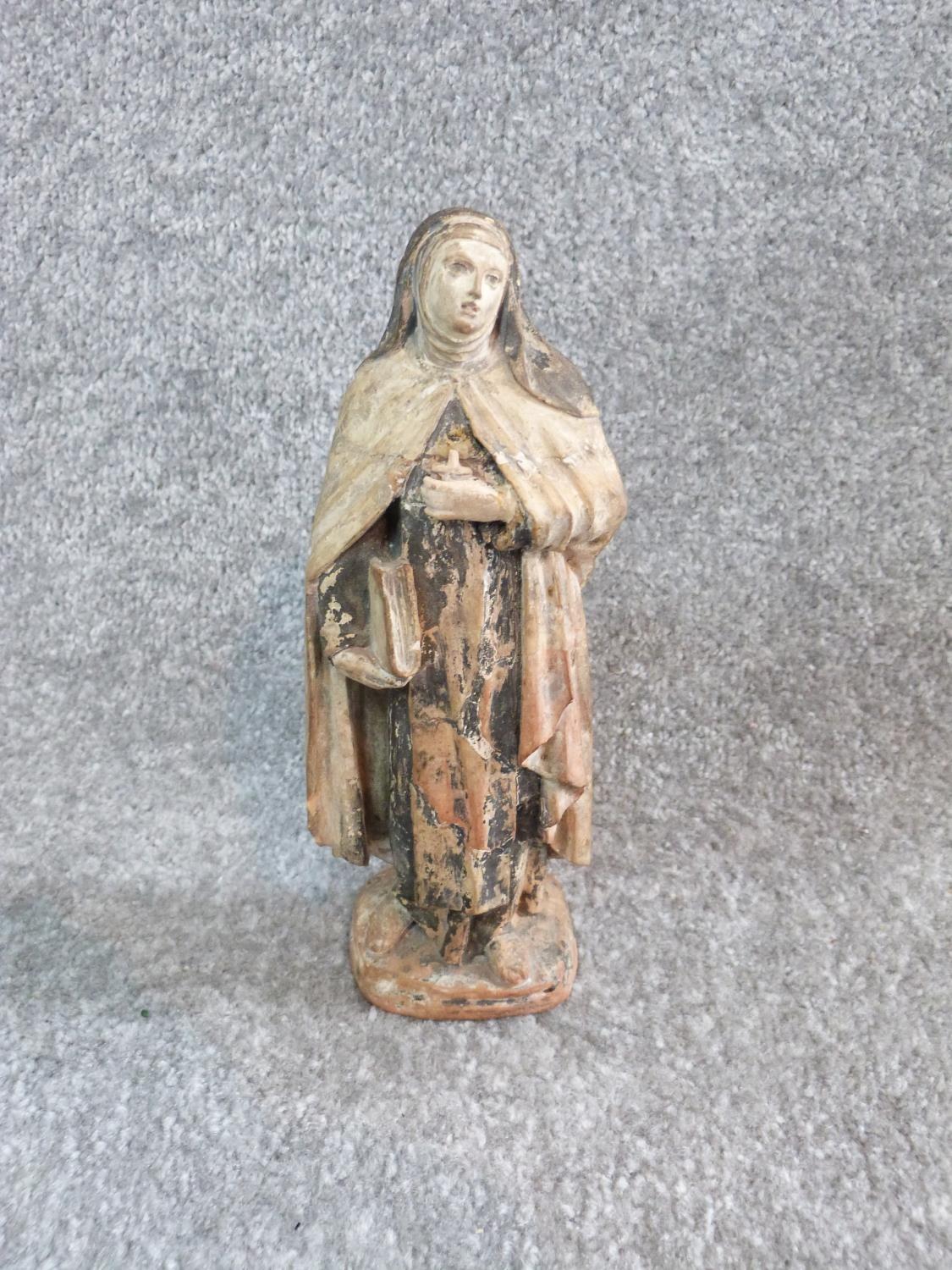 Two antique painted terracotta figures. One of a monk holding a candle and a bible and the other - Image 3 of 14