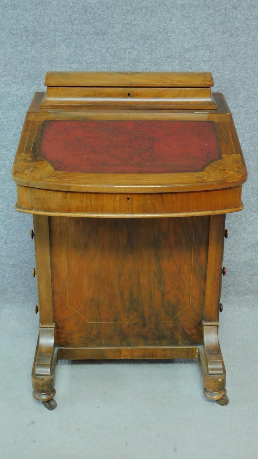 A Victorian burr walnut and satinwood Arabesque inlaid Davenport fitted with four drawers opposing