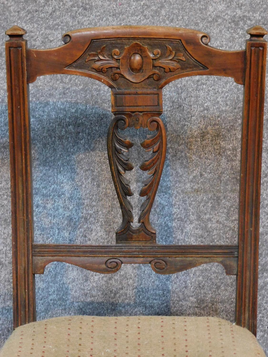 A set of six late Victorian carved walnut dining chairs raised on turned tapering supports. H.91cm - Image 3 of 6