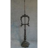 A carved oak Victorian pole screen on naturalistic base, fitted glazed panel. H.158cm