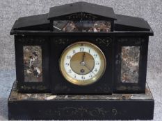 A Victorian style black slate and marble mantle clock. With white enamel and brass dial. Engraved