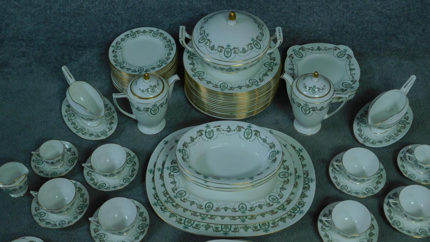 A Minton Adam design complete tea set. With swages and foliate design. Gilding to the handle and - Image 5 of 5