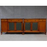 A pair of mid 20th century Georgian style mahogany sideboards, symmetrically designed with a