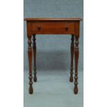 A late 19th century mahogany bedside table with frieze drawer, raised on turned tapering supports.