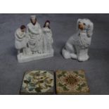 A collection of ceramics. Including a Staffordshire porcelain dog, two antique hand painted tiles