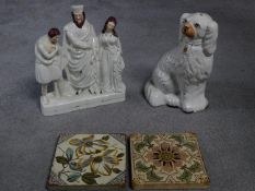 A collection of ceramics. Including a Staffordshire porcelain dog, two antique hand painted tiles