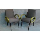 A pair of vintage style bridge armchairs in damask upholstery on splayed dancette style supports.