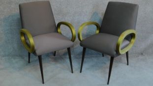 A pair of vintage style bridge armchairs in damask upholstery on splayed dancette style supports.