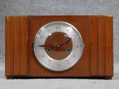 A vibtage oak and metal mantle clock. Red painted numerals. H.22 W.37 D.13cm