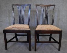 A pair of Georgian mahogany dining chairs. H.92 x 52cm (upholstery original but worn)