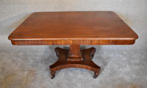 A Victorian mahogany tilt top dining table on quadruped platform base. H.76 x 136 x 72cm