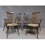 A set of six vintage Ercol Goldsmith model elm dining chairs with tapestry covered squab cushions.