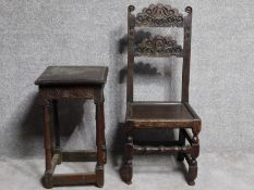 An antique style country oak carved armchair together with a similar side table. H.108cm