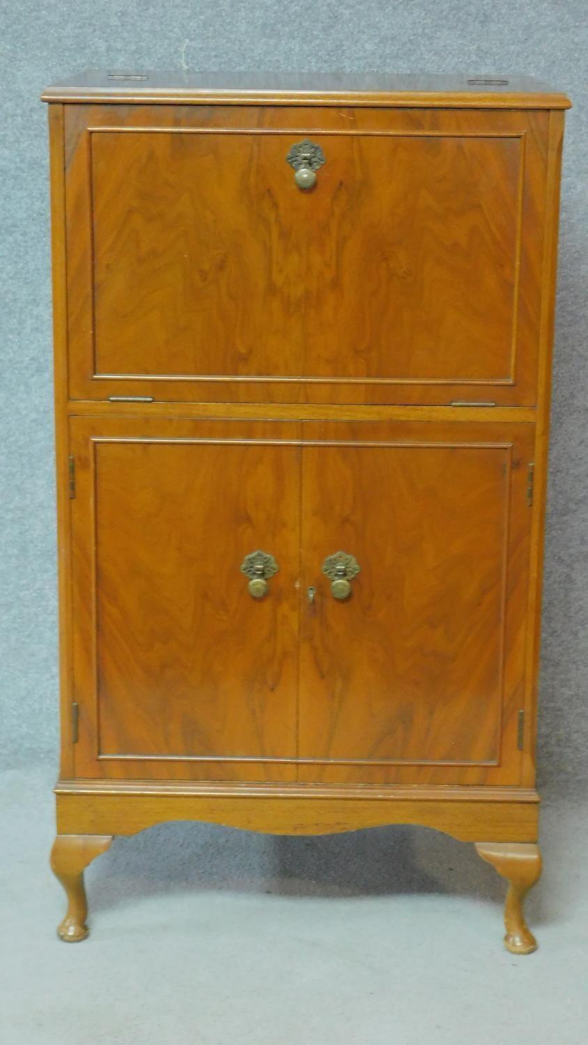 A Georgian style figured walnut cocktail cabinet fitted with mirrored interior raised on cabriole - Image 2 of 7