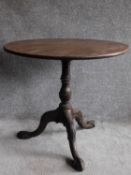 A Georgian mahogany circular tilt top occasional table on well carved tripod cabriole base