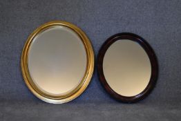 An oval gilt framed mirror and another similar. H.72 x 62cm